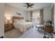Relaxing bedroom with neutral tones, ceiling fan, and natural light from the window at 215 Pintail Dr, Monroe, NC 28110