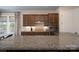 Modern kitchen features stainless steel appliances, stone counters, and wooden cabinets at 215 Pintail Dr, Monroe, NC 28110