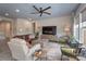 Well-decorated living room featuring a large TV, comfortable seating, and lots of natural light at 215 Pintail Dr, Monroe, NC 28110