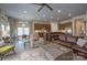 Open-concept living room and kitchen area with hardwood floors and lots of natural light at 215 Pintail Dr, Monroe, NC 28110