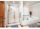 Bathroom featuring a soaking tub with jets, a glass shower, and bright lighting at 2209 Cardinal Loop, Stanley, NC 28164