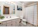 Well-maintained bathroom with a single sink vanity and shower with patterned curtain at 2209 Cardinal Loop, Stanley, NC 28164
