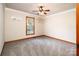 Cozy bedroom with neutral walls, plush carpet, and natural light from the window at 2209 Cardinal Loop, Stanley, NC 28164