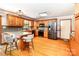 Well-lit kitchen featuring stainless steel appliances, wood cabinets, and an island with bar stool seating at 2209 Cardinal Loop, Stanley, NC 28164