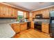 This kitchen boasts wood cabinets, stone countertops, and stainless steel appliances at 2209 Cardinal Loop, Stanley, NC 28164