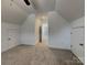 Bedroom with neutral carpet, a ceiling fan, multiple closets and a doorway at 231 Brook Se Ave, Concord, NC 28025