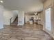 Open concept view of the living room and kitchen featuring modern finishes and a staircase at 231 Brook Se Ave, Concord, NC 28025