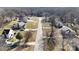 This aerial shot displays neighborhood homes situated on a street lined with trees in winter at 2316 Woodfield Cir, Gastonia, NC 28056