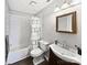 Classic bathroom features a shower with subway tile and a wood vanity at 2316 Woodfield Cir, Gastonia, NC 28056