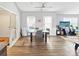 Bright dining room features wood floors, a ceiling fan, and a glass table at 2316 Woodfield Cir, Gastonia, NC 28056