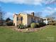 Charming home with a well-manicured lawn, shrubbery and mature trees at 2316 Woodfield Cir, Gastonia, NC 28056