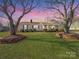 Charming one-story home with a cozy front porch and manicured lawn at 2316 Woodfield Cir, Gastonia, NC 28056