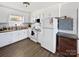 Clean kitchen features white cabinets, laminate counters, and updated appliances at 2316 Woodfield Cir, Gastonia, NC 28056