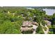 Breathtaking aerial view of an expansive waterfront property nestled among lush greenery and mature trees at 2354 Valelake Rd, York, SC 29745