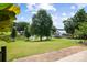 Expansive backyard with lush lawn, mature trees, and lake access with private boat docks at 2354 Valelake Rd, York, SC 29745