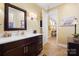 Bathroom featuring wood floors, a dark brown vanity, and a doorway that leads to another room at 2354 Valelake Rd, York, SC 29745