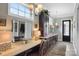 Elegant bathroom vanity area features a spacious countertop, dark cabinets, and decorative lighting fixtures at 2354 Valelake Rd, York, SC 29745