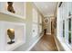 Hallway with artistic architectural display cases, wood flooring, and natural light at 2354 Valelake Rd, York, SC 29745