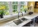 Bright kitchen with stainless steel sink, white countertops, and a view of the lake at 2354 Valelake Rd, York, SC 29745
