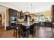 Gourmet kitchen with seating around the center island, stainless appliances, and custom cabinetry at 2354 Valelake Rd, York, SC 29745