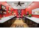 Laundry room featuring dark red walls, dark wood cabinets, and a spacious countertop with sink at 2354 Valelake Rd, York, SC 29745