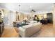 Spacious living room with neutral-toned sofas, hardwood floors, and an open floorplan leading to the kitchen at 2354 Valelake Rd, York, SC 29745
