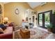 Cozy living room with an ornate rug, warm yellow walls, and unique decor at 2354 Valelake Rd, York, SC 29745