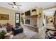 Cozy living room featuring a stone fireplace, soft lighting, and comfortable seating at 2354 Valelake Rd, York, SC 29745