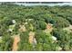 Aerial view of property with lake access and surrounding woods at 248 Pioneer Dr, Mount Gilead, NC 27306