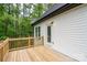 Wooden deck off the back of a home surrounded by a lush forest offering a relaxing outdoor space at 248 Pioneer Dr, Mount Gilead, NC 27306