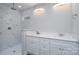 Bathroom featuring double sink vanity with white marble shower surround at 248 Pioneer Dr, Mount Gilead, NC 27306