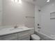 Bathroom featuring a vanity with a white countertop, a toilet, and tiled shower-tub combo at 248 Pioneer Dr, Mount Gilead, NC 27306