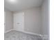 Bedroom featuring a closet with double doors, neutral colors and soft carpeting at 248 Pioneer Dr, Mount Gilead, NC 27306