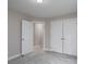Bedroom with open door, closet doors, neutral colors and soft carpeting at 248 Pioneer Dr, Mount Gilead, NC 27306