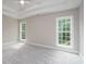 Bright bedroom with carpet, two large windows and tray ceiling at 248 Pioneer Dr, Mount Gilead, NC 27306
