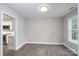 Dining area off the kitchen with natural light and wood-look flooring at 248 Pioneer Dr, Mount Gilead, NC 27306