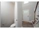 Inviting entryway with half bath and staircase to the second floor at 248 Pioneer Dr, Mount Gilead, NC 27306