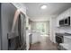 Bright kitchen with stainless steel appliances, white cabinets, white countertops, and hardwood floors at 248 Pioneer Dr, Mount Gilead, NC 27306