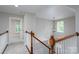 Landing at the top of the stairs with a view of the front entry and windows at 248 Pioneer Dr, Mount Gilead, NC 27306