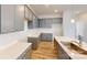 The kitchen has shaker style gray cabinets, bright countertops and a modern single bowl sink at 2547 Ruby Dixon Crossing Dr # 17, Gastonia, NC 28056