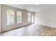 The living area features wood floors, multiple windows, and a back door to the outside at 2547 Ruby Dixon Crossing Dr # 17, Gastonia, NC 28056