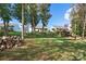 Expansive backyard with lush green grass and mature trees, offering serene views of the property at 25566 Seagull Dr, Lancaster, SC 29720