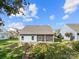 Backyard featuring a screened porch and gentle slope with retaining wall and steps at 25566 Seagull Dr, Lancaster, SC 29720