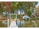 A charming backyard with access to the lake, surrounded by mature trees at 25566 Seagull Dr, Lancaster, SC 29720