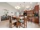 Inviting dining room adjacent to the kitchen, featuring bar stool seating and ample lighting at 25566 Seagull Dr, Lancaster, SC 29720