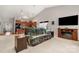 Open living room and kitchen layout with hardwood floors, vaulted ceiling, and a comfortable sofa at 25566 Seagull Dr, Lancaster, SC 29720