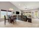 Bright living room featuring vaulted ceilings, large windows, and cozy seating arrangements at 25566 Seagull Dr, Lancaster, SC 29720