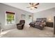 Comfortable main bedroom with a ceiling fan, plush carpeting, and a view of the lake at 25566 Seagull Dr, Lancaster, SC 29720