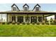 An inviting porch with a charming design, complemented by a well-manicured lawn at 25566 Seagull Dr, Lancaster, SC 29720