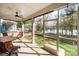 Screened porch with ceiling fan and view of the lake at 25566 Seagull Dr, Lancaster, SC 29720